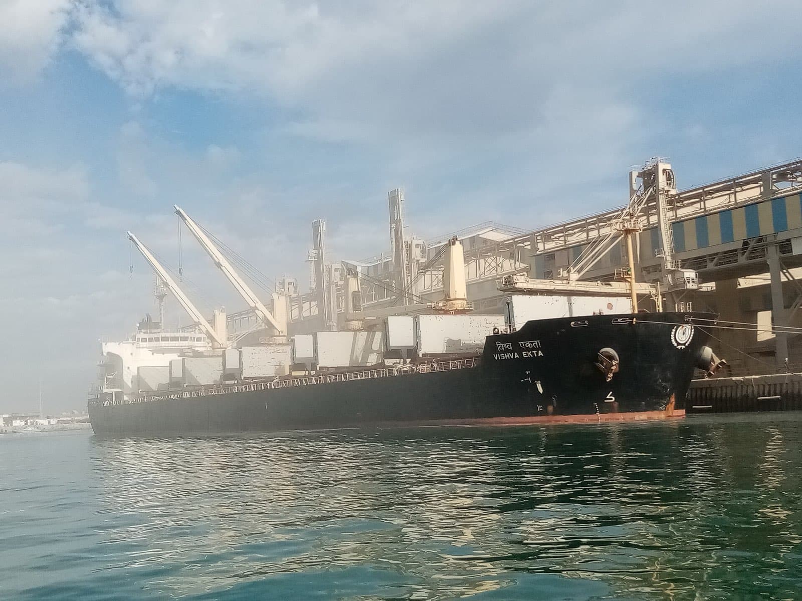 Bulk carrier Vishva Ekta moored at a loading berth